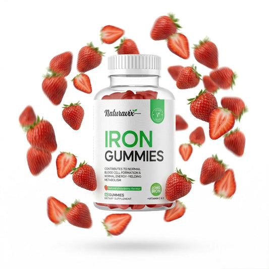 Bottle of Naturavix Iron Gummies surrounded by strawberries on a white background